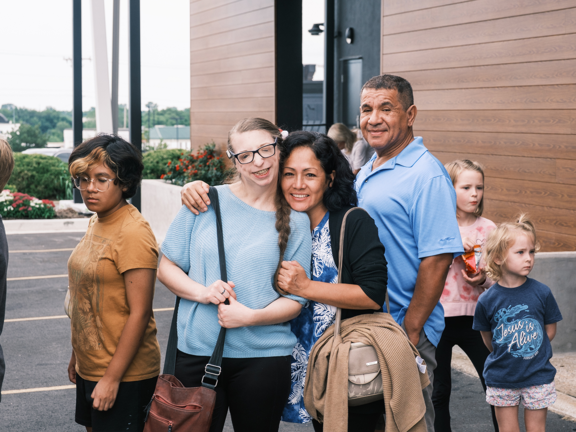 Group of people smiling outside of Church on the Move in Broken Arrow, Oklahoma