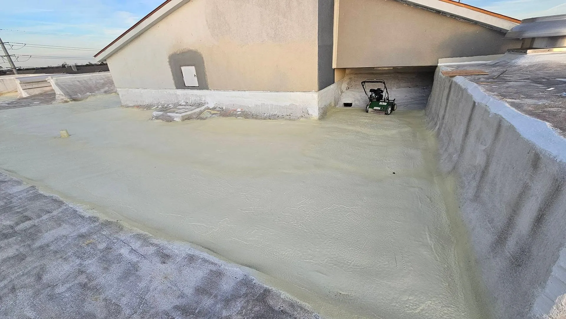 Freshly restored commercial spray foam roof featuring a seamless waterproof coating that improves in 