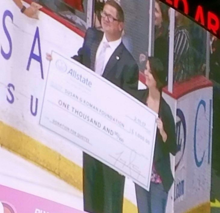 Agency Community donation to the Komen foundation, at the yearly Pink in the Rink Iowa Wild game!!