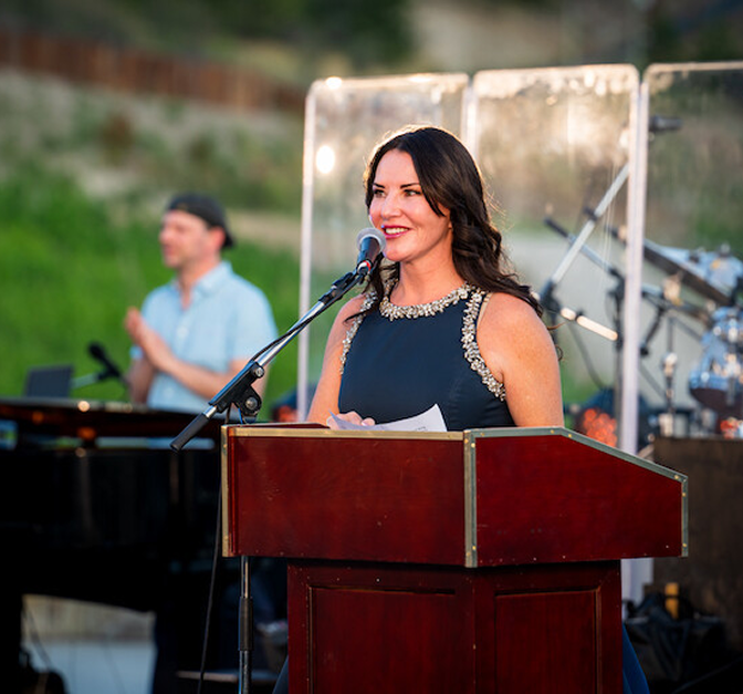 Rhonda Hymers speaking at the Once in a Blue Moon charity event.