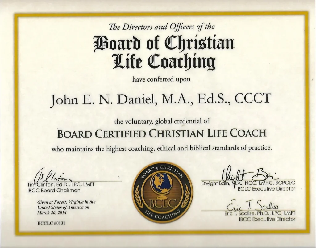 This is a certificate awarded to John E. N. Daniel, M.A., Ed.S., CCCCT for being a Board Certified Christian Life Coach. The certificate is issued by The Directors and Officers of the Board of Christian Life Coaching. It includes signatures from the IBCC Board Chairman, BCLC Executive Director, and IBCC Executive Director, along with the date March 20, 2014, and the location Forest, Virginia. A seal with the inscription "BOARD OF CHRISTIAN LIFE COACHING" is also present.