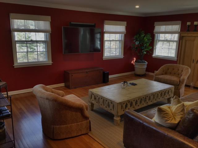 Our Cordless Woven Shades add warmth and texture to this living room in Valhalla. With our easy-to-install shades, you can just sit back and relax knowing our quality shades have you covered.  #BudgetBlindsOssining #WovenWoodShades #ValhallaNY #FreeConsultation #WindowWednesday