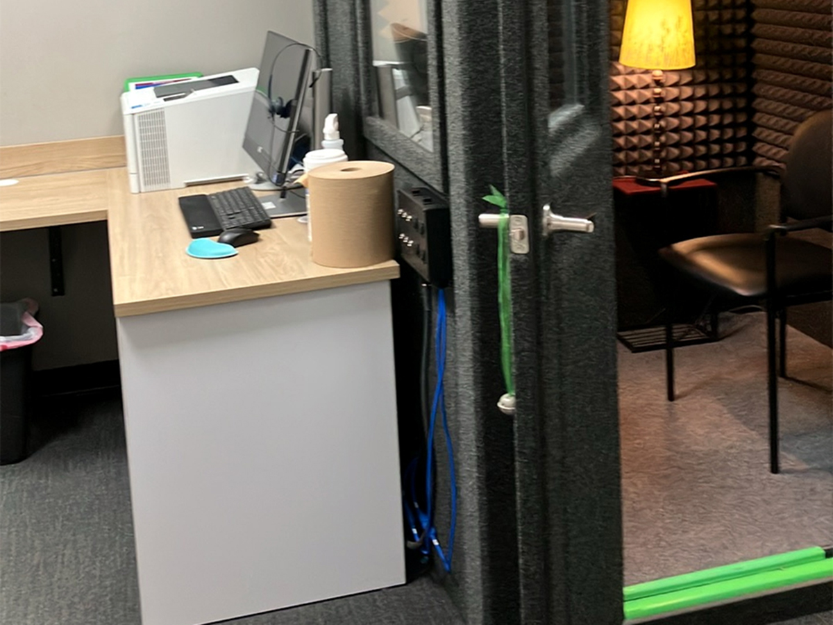 Interior photo of the sound-proof hearing exam booth for AudioNova hearing clinic in Fairview Park, OH