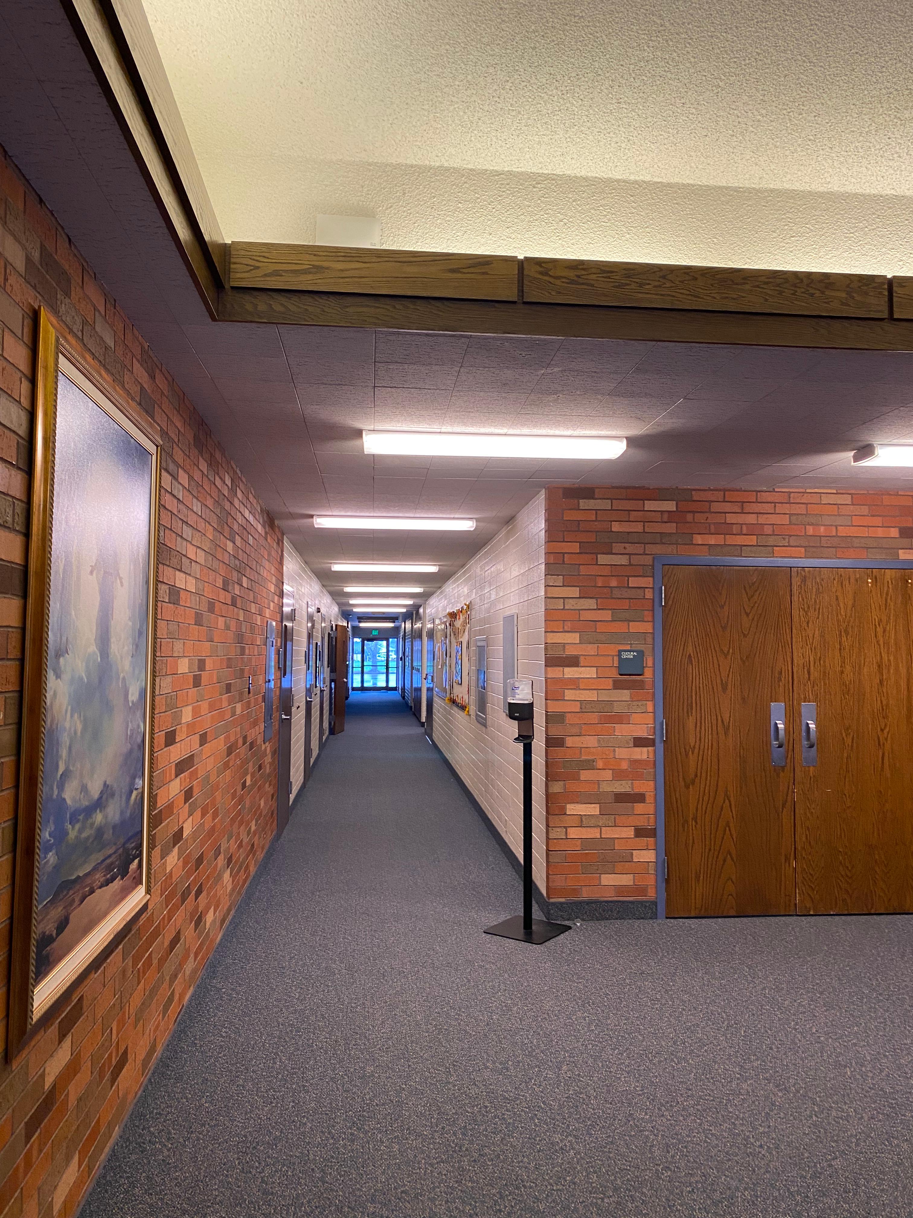 A hallways leading to classrooms, bathrooms, etc.