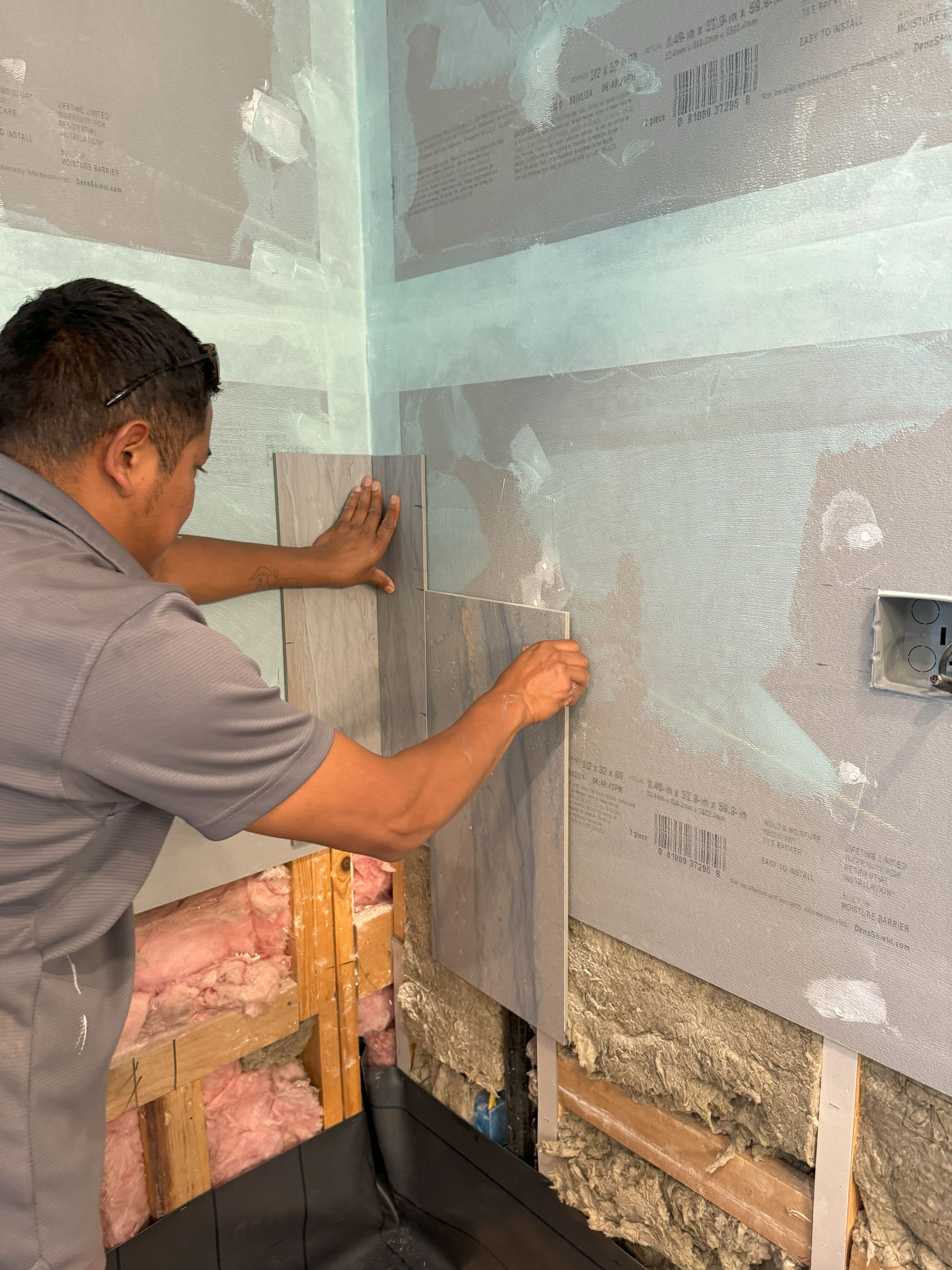 Here’s a behind-the-scenes look at Ledezma Remodeling in action, expertly installing tiles for a bathroom renovation. Our team ensures precision and quality in every step of the process.