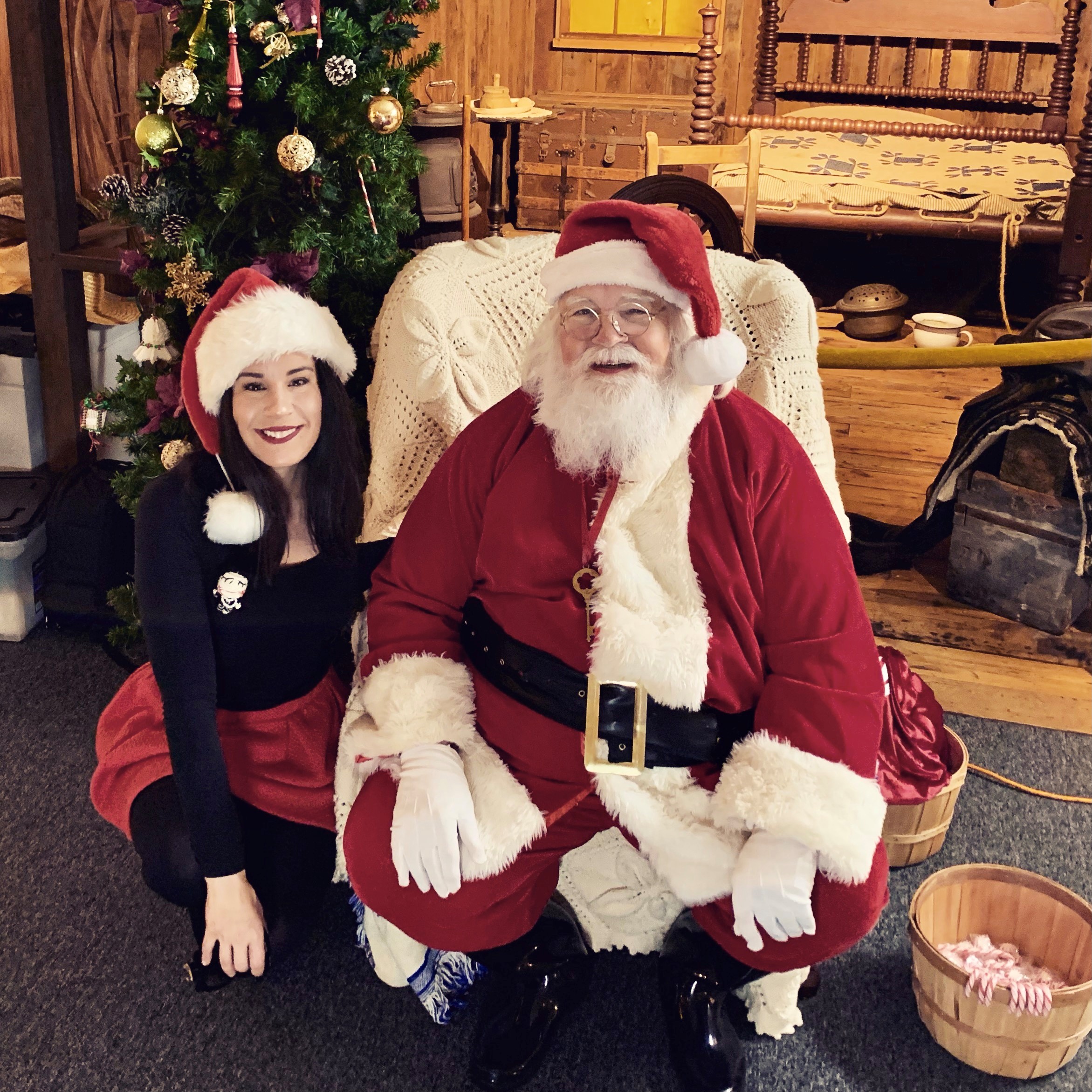 Girl poses with Santa at the museum of the gulf coast’s Christmas family fun day in Port Arthur Texas