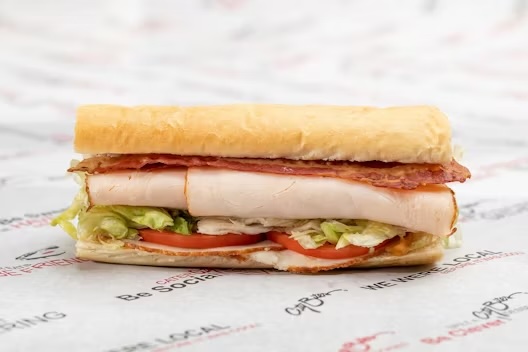 Turkey breast, bacon, marble jack cheese, lettuce, tomatoes, chipotle dressing, salt & pepper.