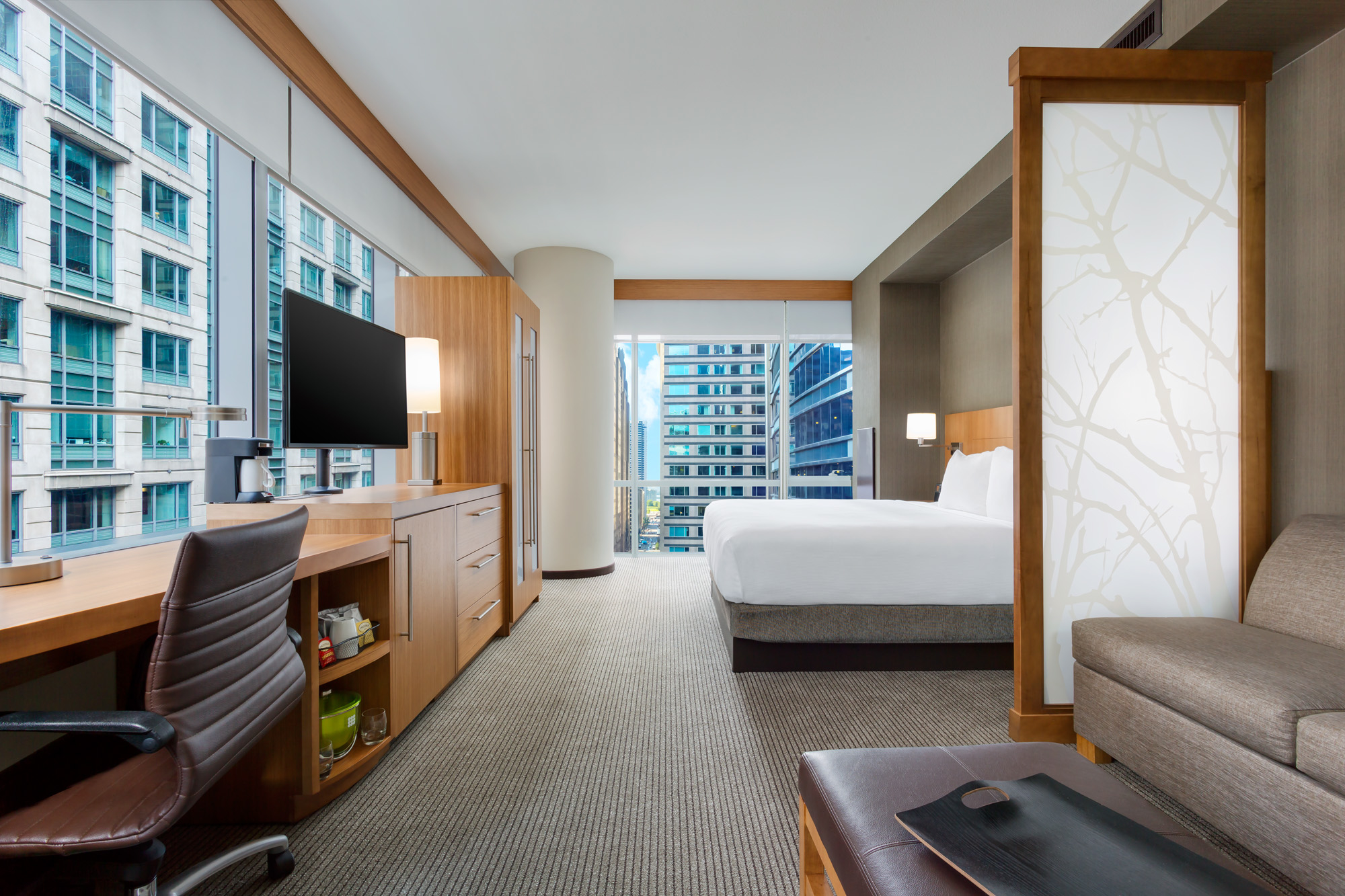 Hyatt Place Chicago Downtown - The Loop King View Room with floor to ceiling windows that provide a beautiful view down Franklin Street. Free Wi-Fi plus mini refrigerator, coffee maker and Cozy Corner sofa sleeper.