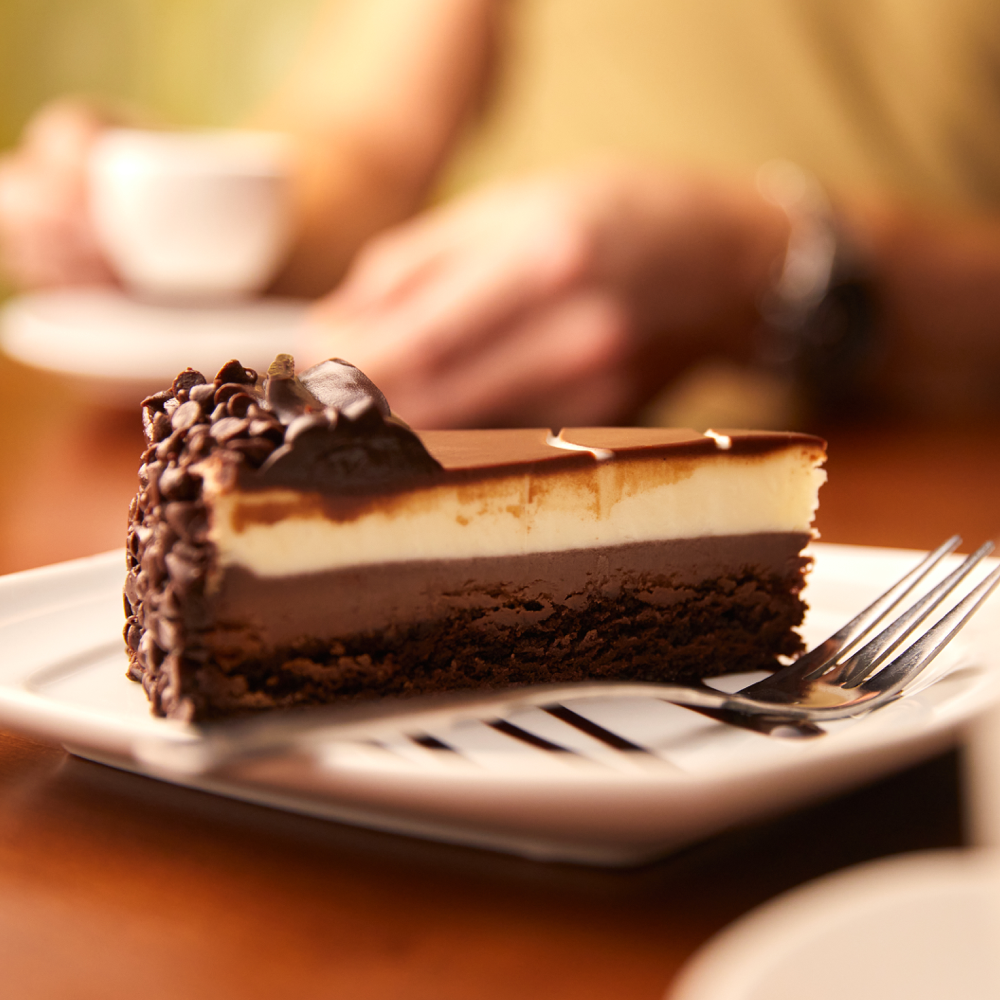 Black Tie Mousse Cake: Chocolate cake, dark chocolate cheesecake and creamy custard with icing.