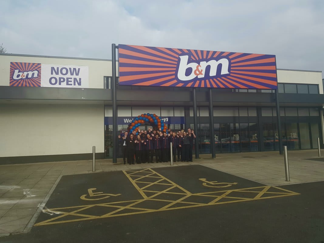 The store team at B&M's newest store in Breightmet pose in front of their wonderful new store, located on Bury Road.