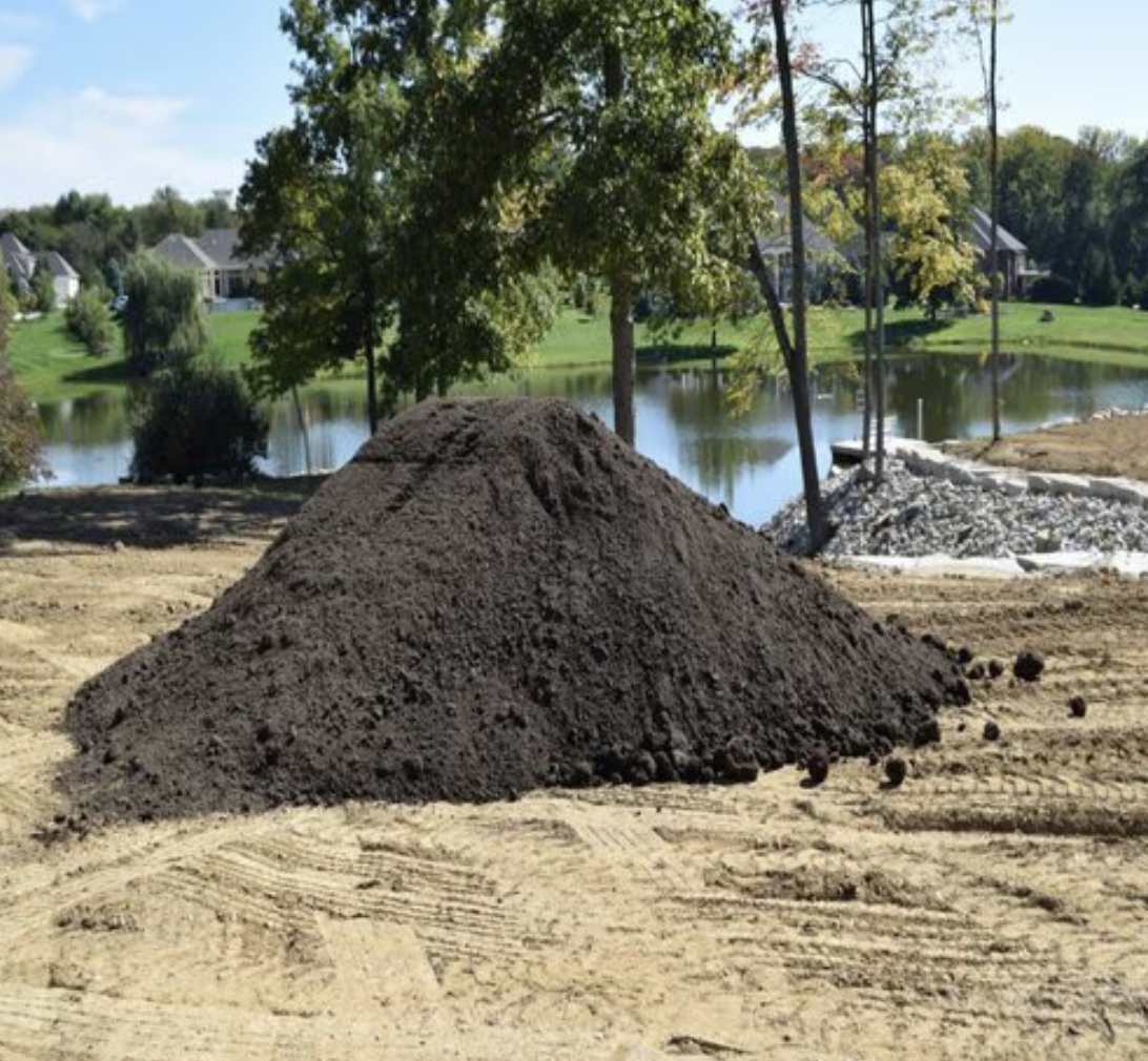 Soil. 50/50 Compost and Screened Top Soil Mix Bulk (per cu. yd.)
Nutrient-rich blend for healthy plant growth.
Optimal water retention and drainage.
Balanced mix of compost and screened topsoil.
Supports moisture retention and promotes healthy root systems
Ideal for raised beds, garden plots, and plant growth
This premium Mixed Soil blend combines the natural richness of topsoil with the nutrient-dense properties of compost, creating an ideal growing medium for a variety of garden needs. Designed to provide optimal soil structure, it offers superior drainage and aeration, making it perfect for raised beds, garden plots, or planting spaces that require a balanced foundation for robust plant growth. With its 50% topsoil and 50% compost ratio, this bulk option ensures a sustainable, eco-friendly solution that supports healthy soil fertility and plant vitality for any gardening project. Amend your garden beds with this versatile and budget-friendly option to promote growth, improve root establishment, and maintain moisture. The organic compost component helps break down organic material, providing essential nutrients over time, while the topsoil provides stability and structure for long-lasting soil health.