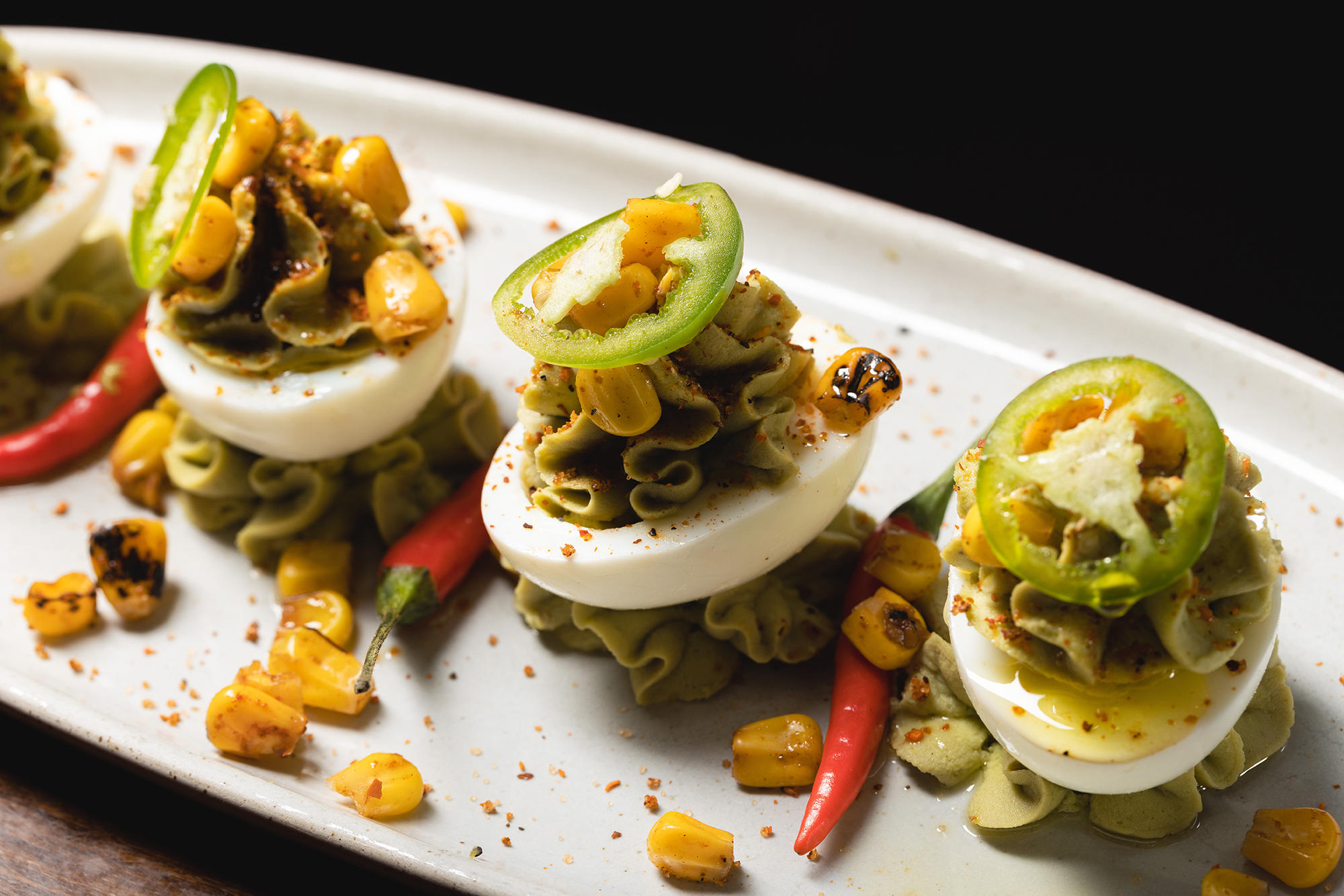 Kick off your meal at The Independent with our fun and festive Fiesta Deviled Eggs by the Theatre District