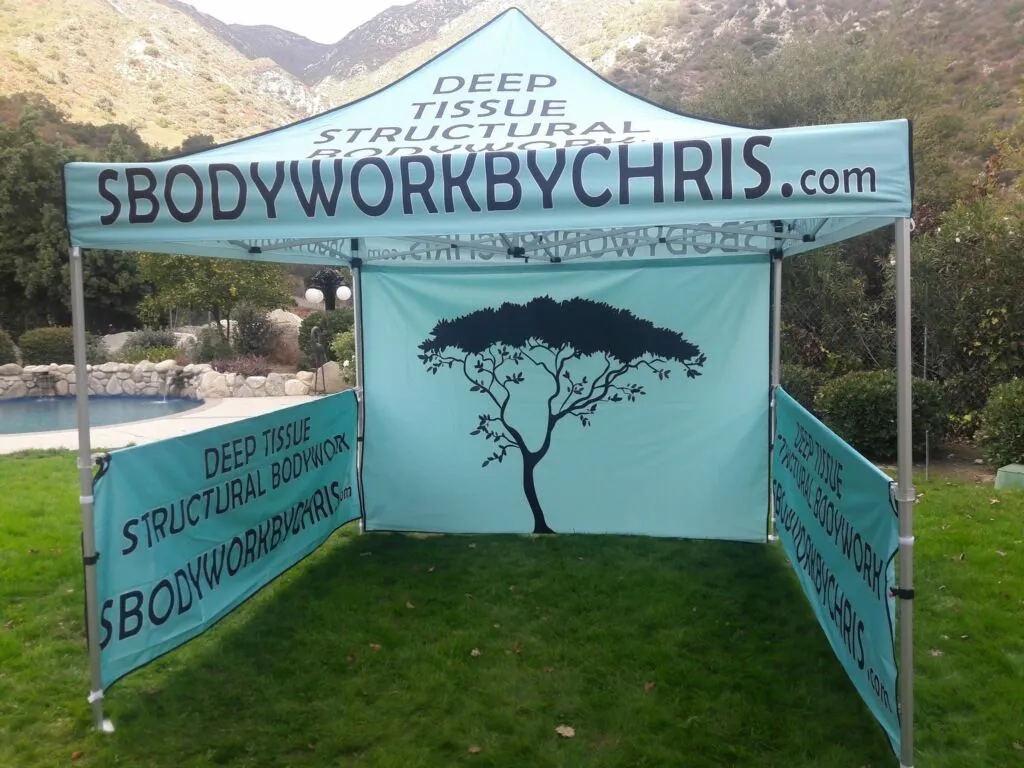 Branded SBodyWork by Chris promotional canopy showcasing deep tissue structural bodywork services at 