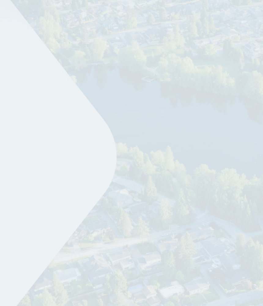 Aerial view of a neighbourhood and a pond in Coquitlam, British Columbia.