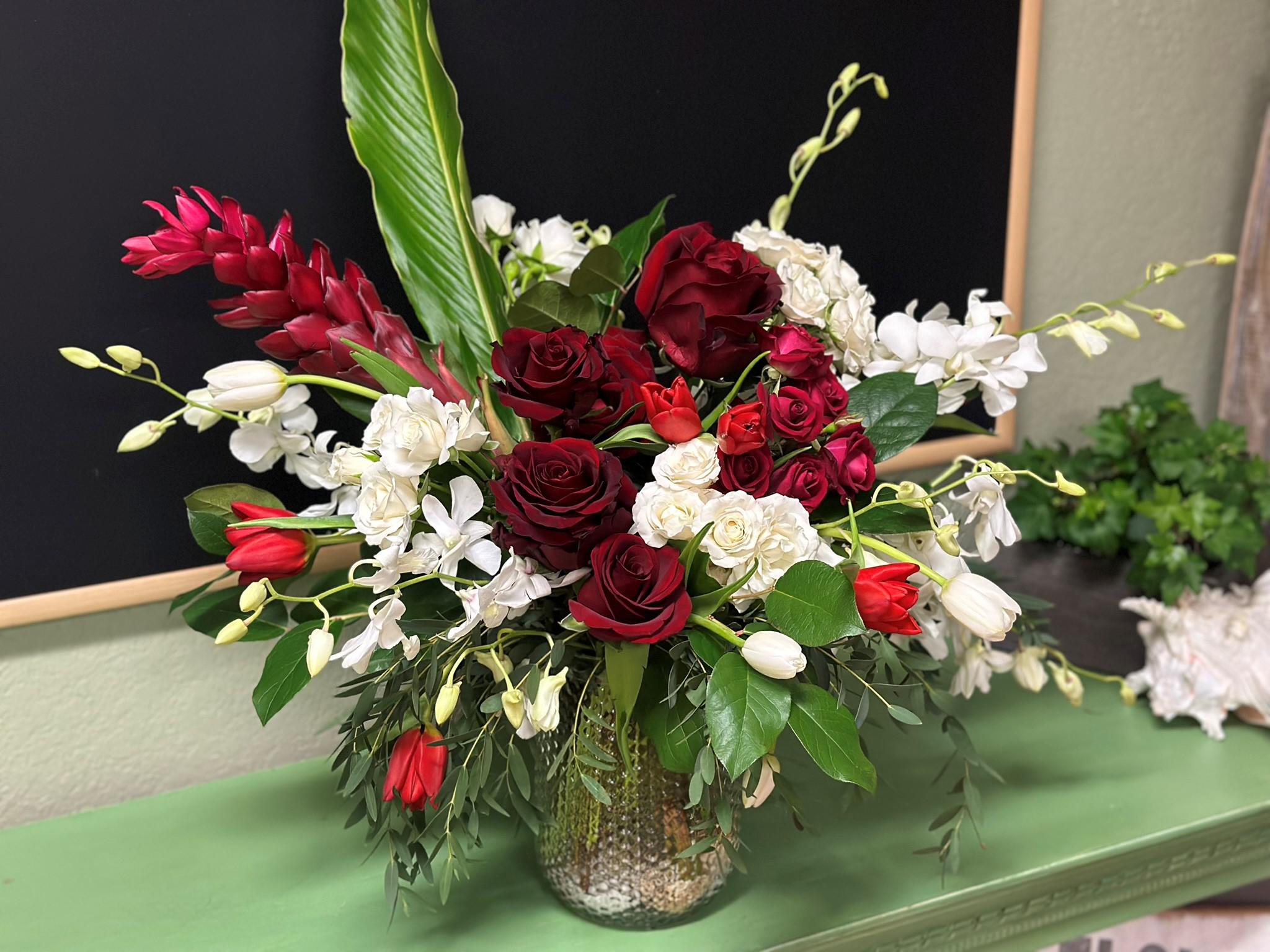 Meet Burst - Fresh Ginger, Epic Roses, Orchids and Snow White and Red Tulips.

Flowers Designed to make memories