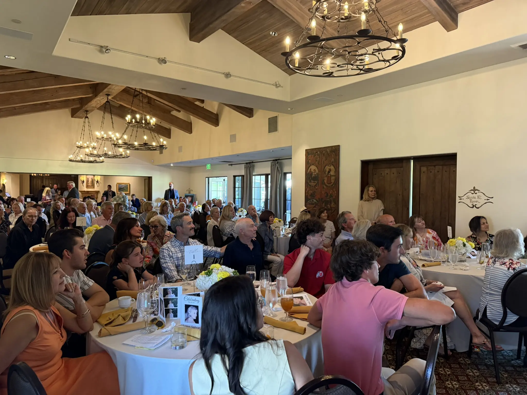Family and friends raising a toast in memory of their loved one