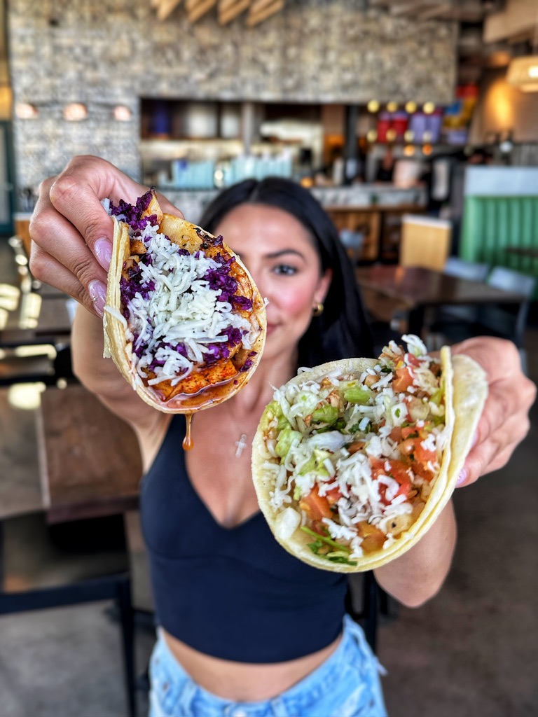 Grilled fish taco with honey butter glaze, purple cabbage and cheese 