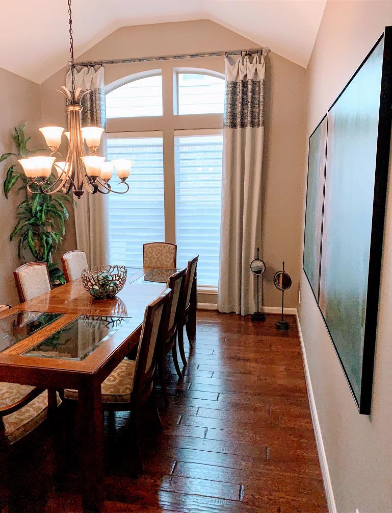 Combine Hunter Douglas Silhouettes, Custom Drapery Panels on Iron Rings and Rod with Crystal Finials and the finished result will be a master piece! Budget Blinds of Katy and Sugar Land did that for this Katy, TX dining room and all guests are talking about how great it is. #BudgetBlindsKatySugarLan