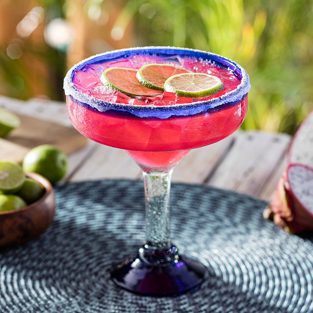 Dragon Fruit Margarita - PatroÌn Silver Tequila, triple sec, dragon fruit, key lime juice, sweet & sour with a sugar rim.