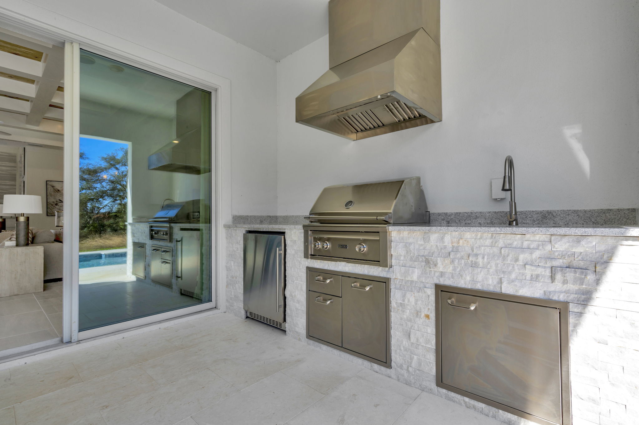 The Backyard Summer Kitchen of a DRB Homes Sabal Model at Serengeti in Spring Hill, FL.