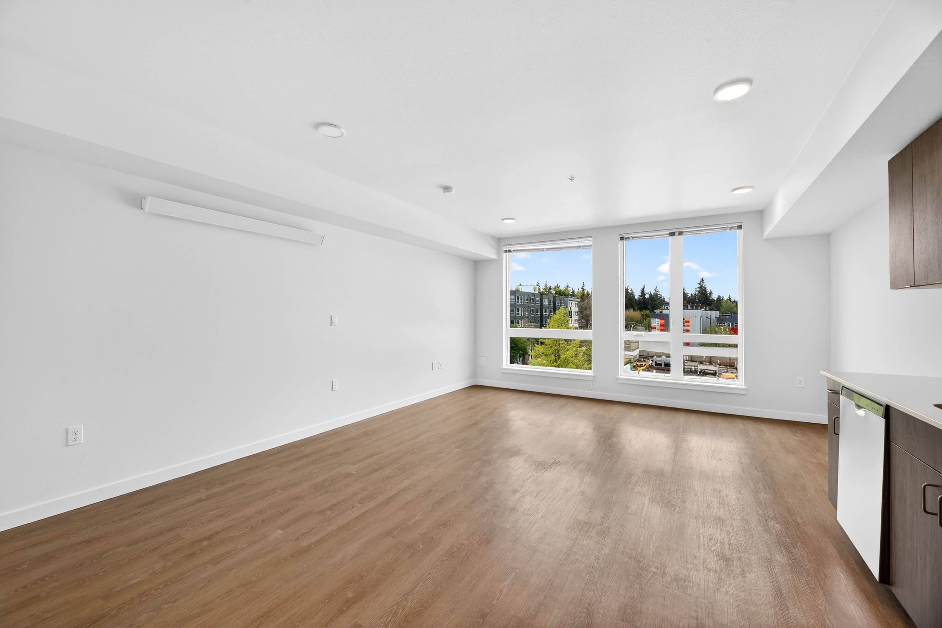 Spacious living room with wood flooring