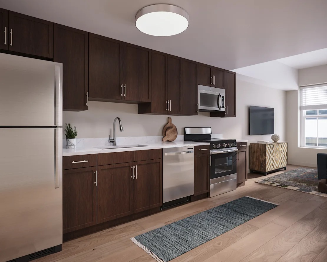 A modern kitchen with wooden cabinets and stainless steel appliances. 