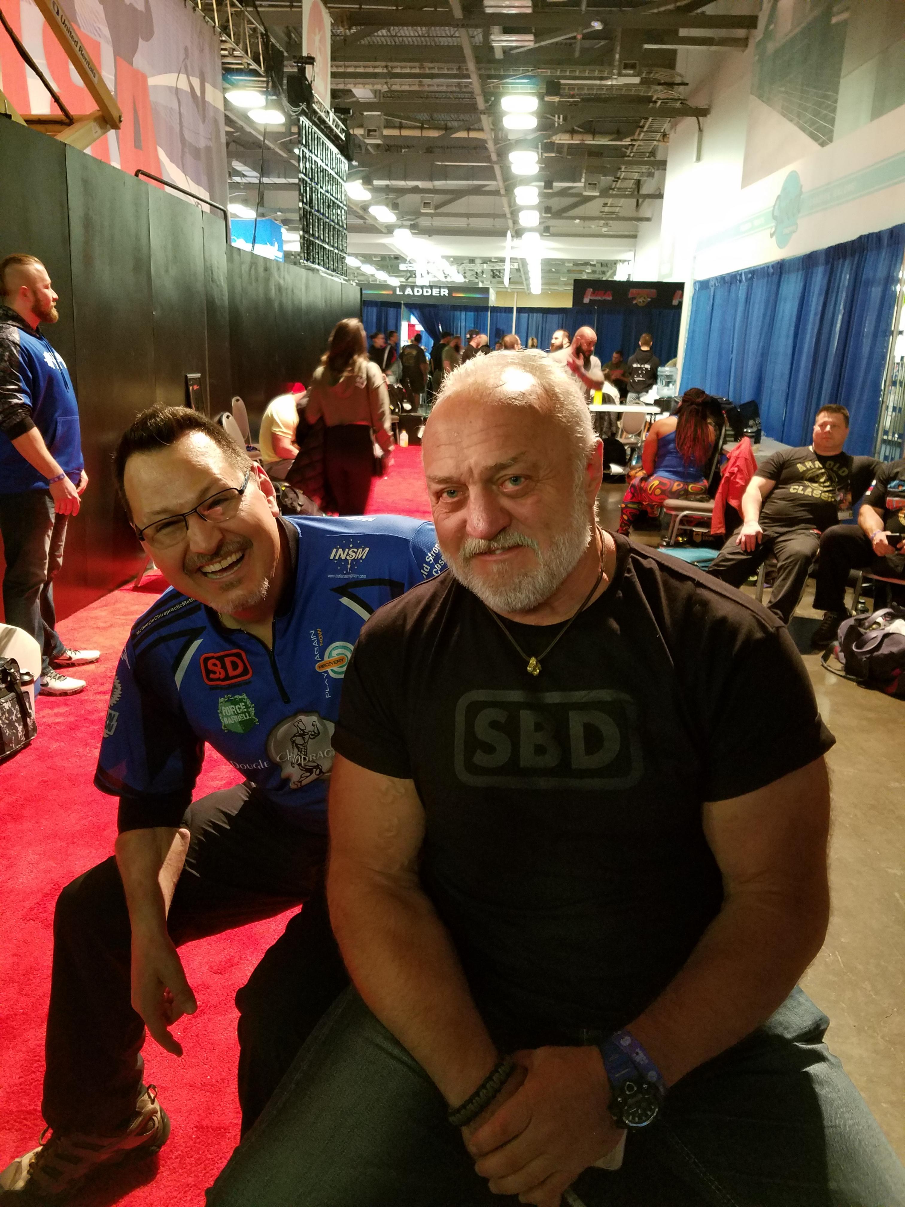 Dr. McDougle poses in this picture with three-time strongest man man champ Bill Kazmaier.