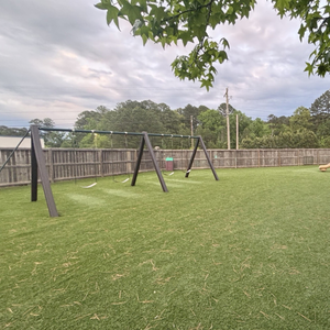 Safe, fenced playground area at Childcare Network where children enjoy active outdoor play