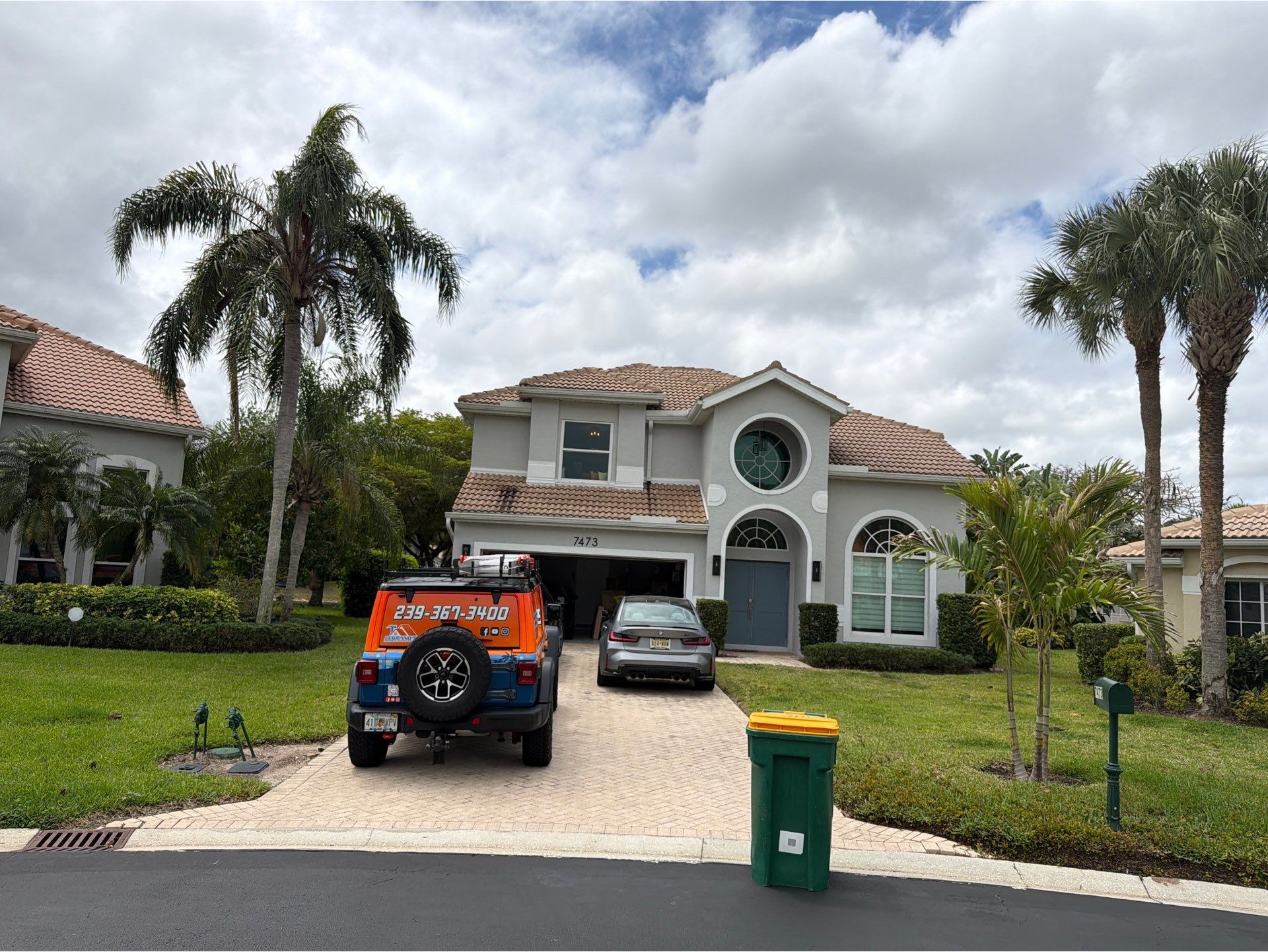 Front view of a Florida home where roofing work is being completed, showing Legrand’s Roofing & Cons 