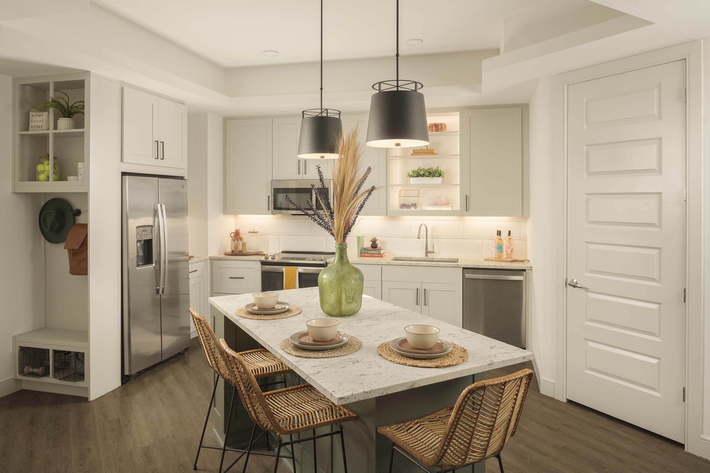Kitchen with island and entry drop zone at Camden Gilbert apartment homes in Gilbert, AZ