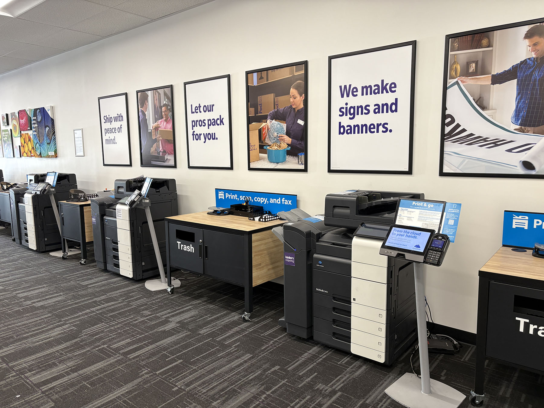 Print and Shipping Messaging Wall &ndash; In-store signage highlighting printing services, packing support, and shipping solutions.