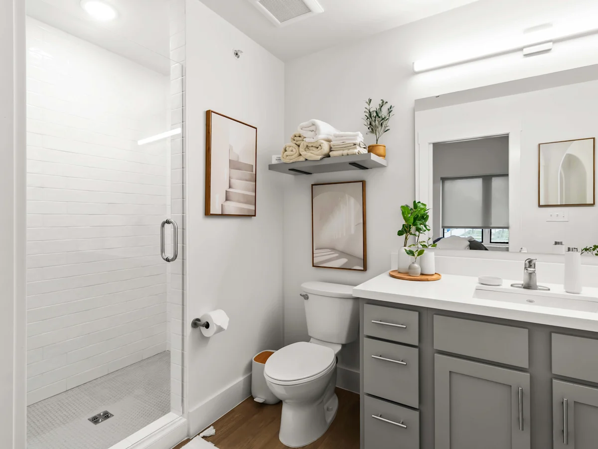 A Bathroom With Sink and Mirror at G at Market Apartments, Arkansas