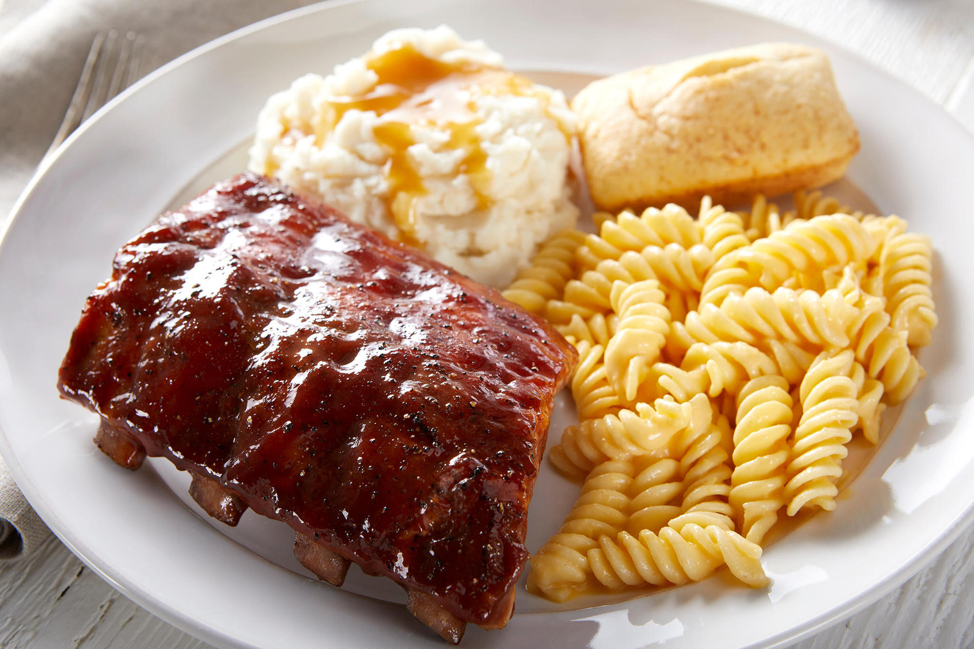 New! Baby Back Ribs. Our slow-cooked, fall-off-the-bone Baby Back Ribs are seasoned then brushed with sweet hickory BBQ sauce.