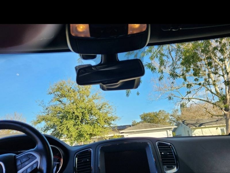 The ADAS camera behind the rearview mirror. We recalibrate it after every windshield we replace.