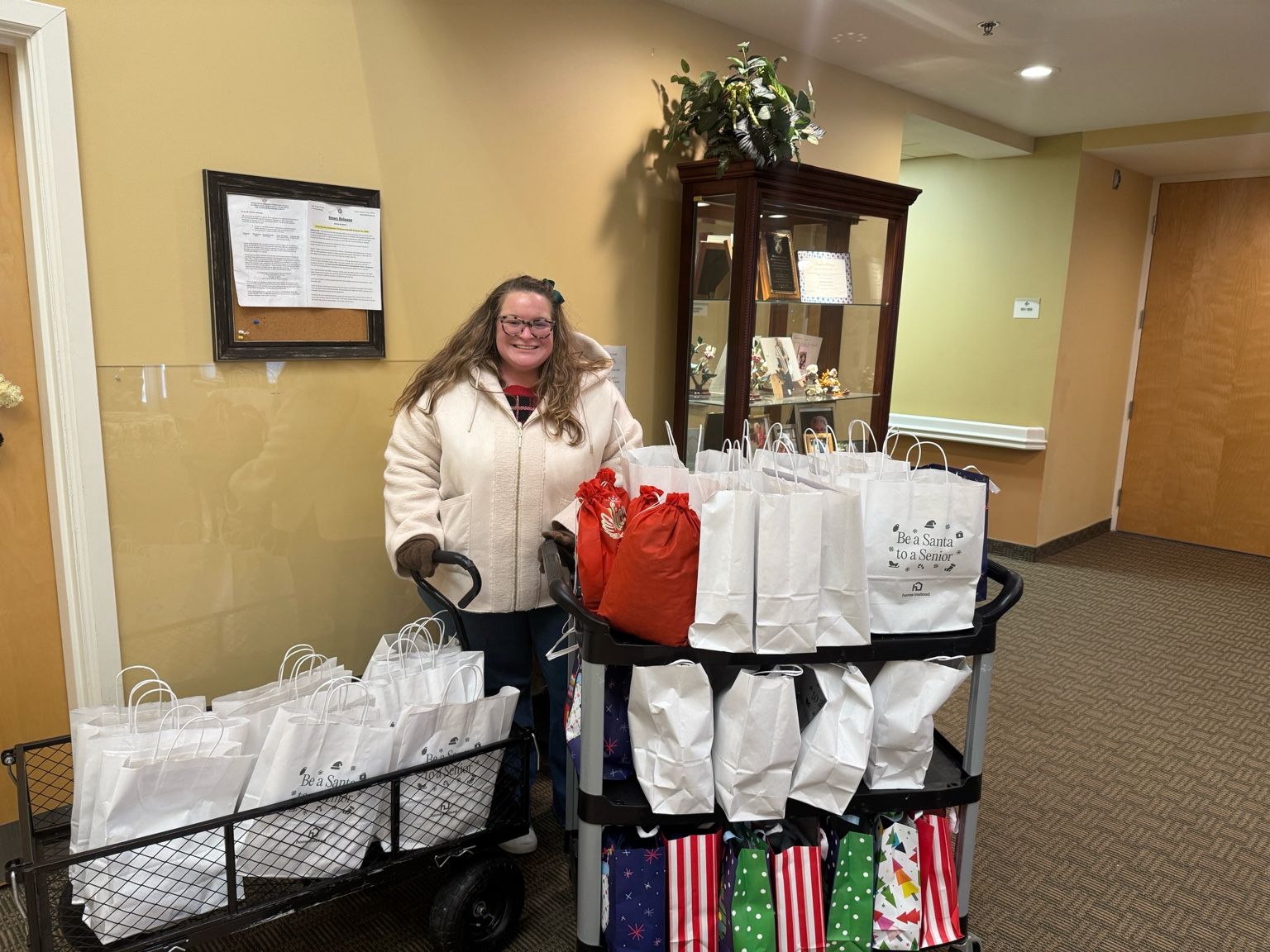 Home Instead team delivering gifts through the Be a Santa to a Senior program to bring joy and connection to older adults.