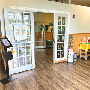 Bright and colorful preschool classroom at Childcare Network with age-appropriate learning materials