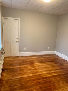 We refinished the floor, added trim, and painted this room in Haverhill, MA.