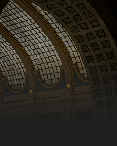 An interior shot of beautiful municipality building with a glass-domed ceiling.