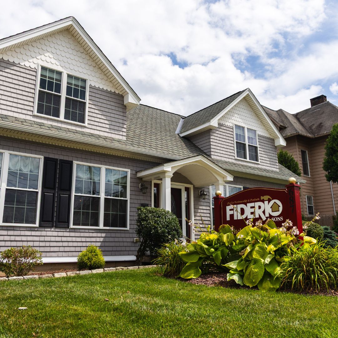 The Fiderio & Sons headquarters located at 687 Broad St, Meriden, CT, with lush landscaping and classic signage.