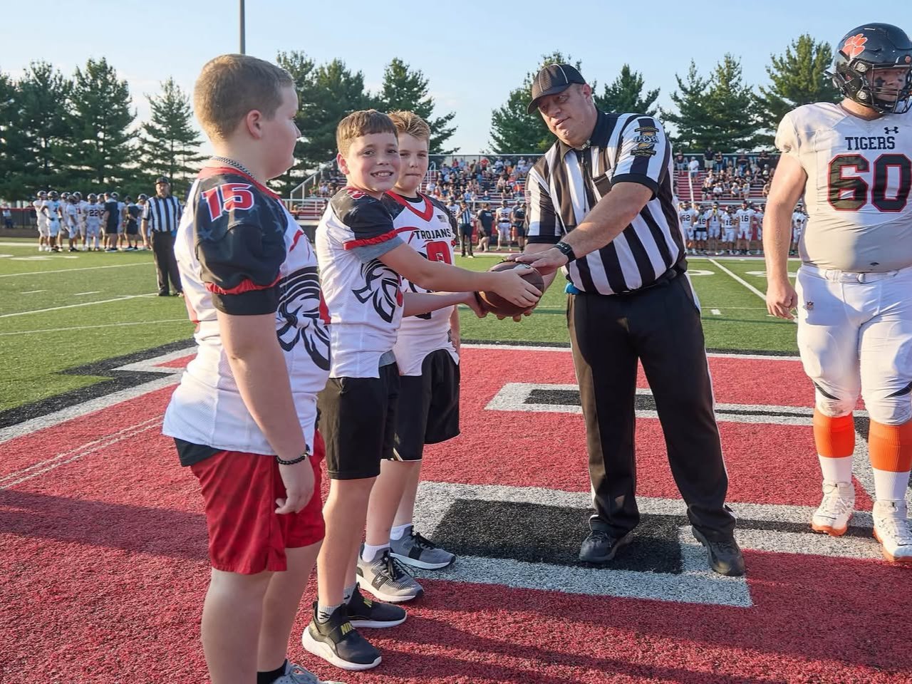 Each year, I sponsor the game ball for East Central High School home football games and get to share the experience with three Pee Wee players. Seeing their excitement makes it even more memorable. Thank you, Sandy Mahoney, for the photos!