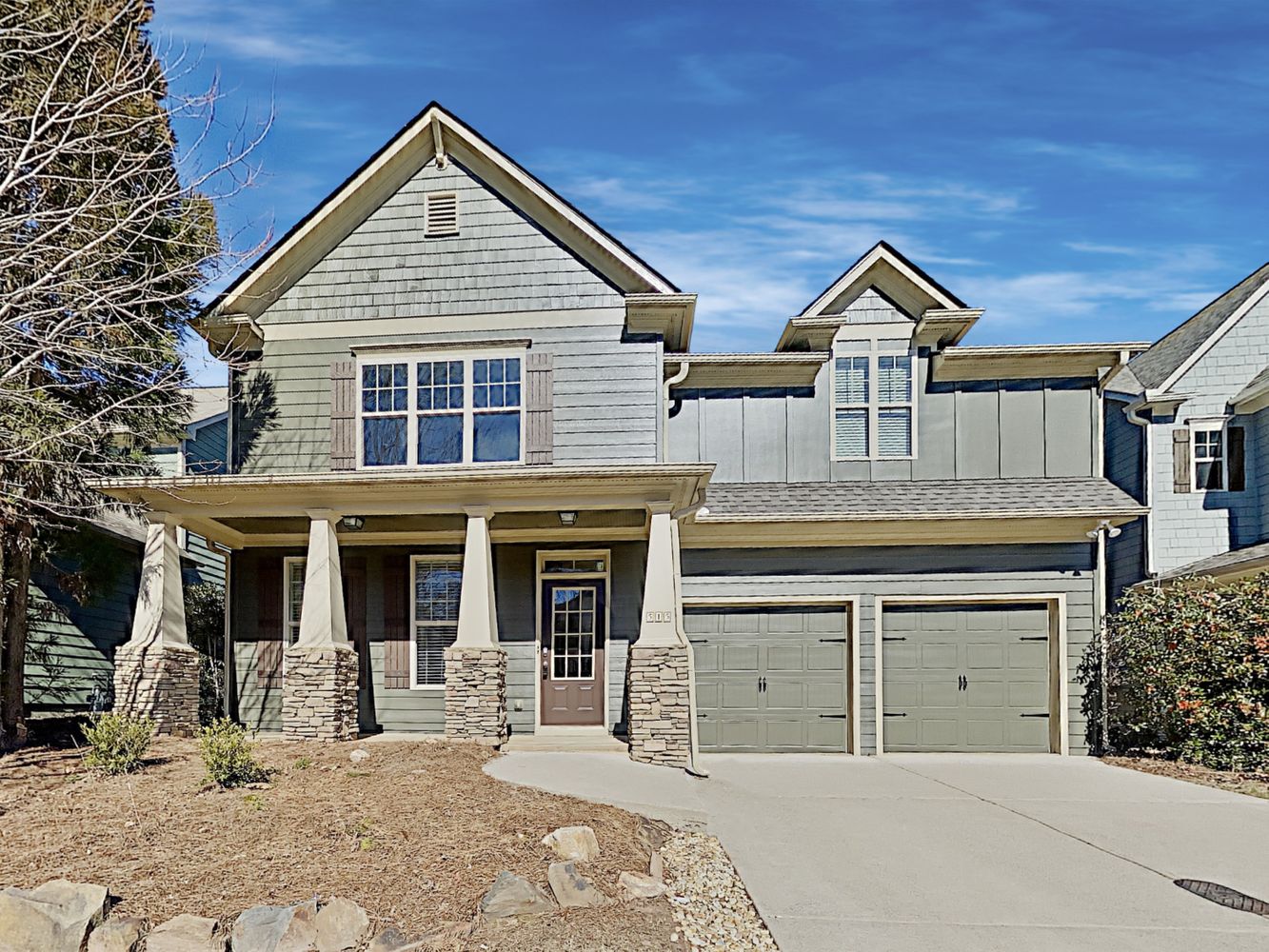 Gorgeous home with covered porch and a two-car garage at Invitation Homes Atlanta.