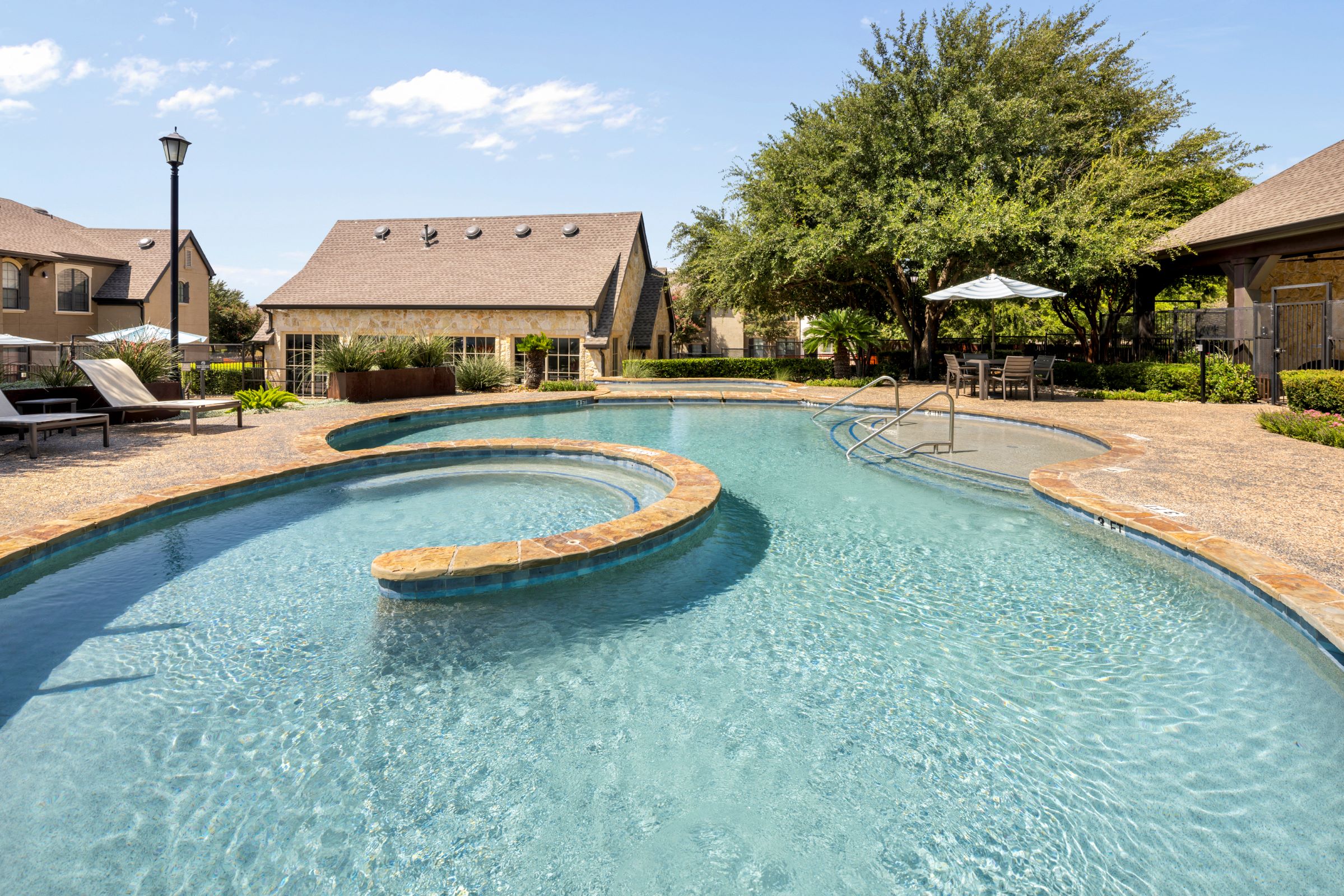 Top level of resort-style pool next to the fitness center at Camden Shadow Brook apartments in Austi 