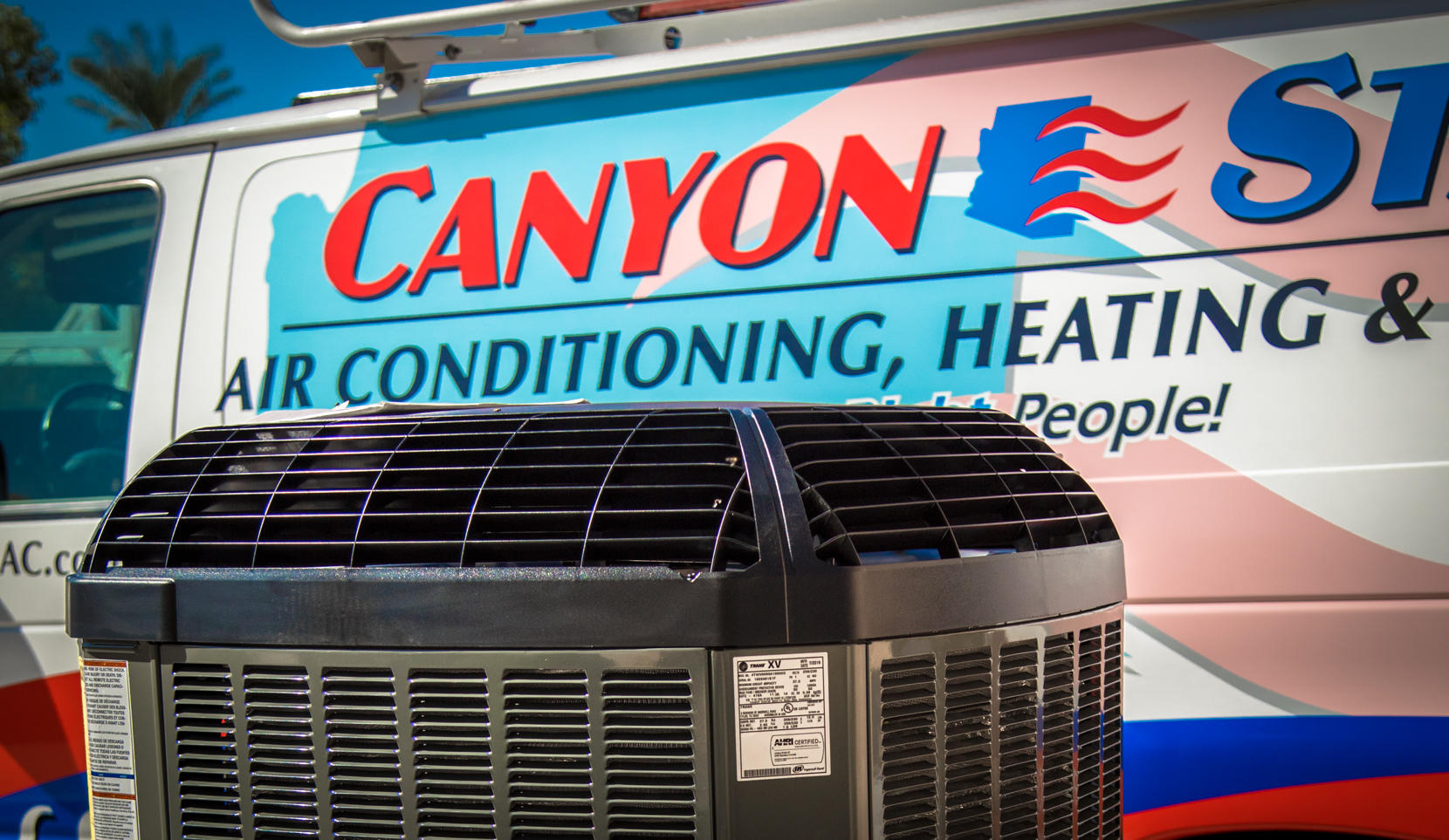 HVAC equipment sitting in front of the company van