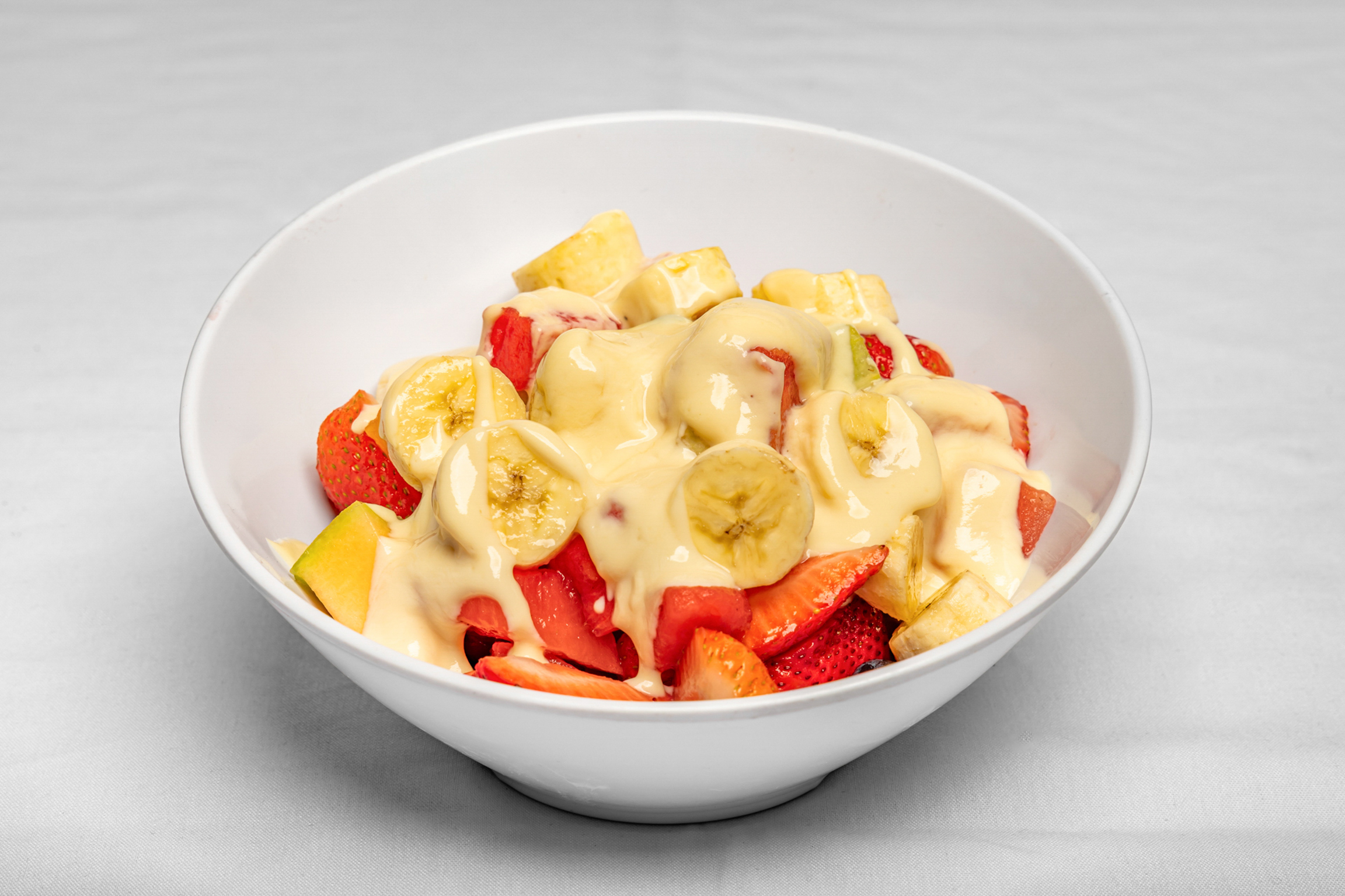 A fresh mix of seasonal fruits served with creamy yogurt for a light and refreshing option.