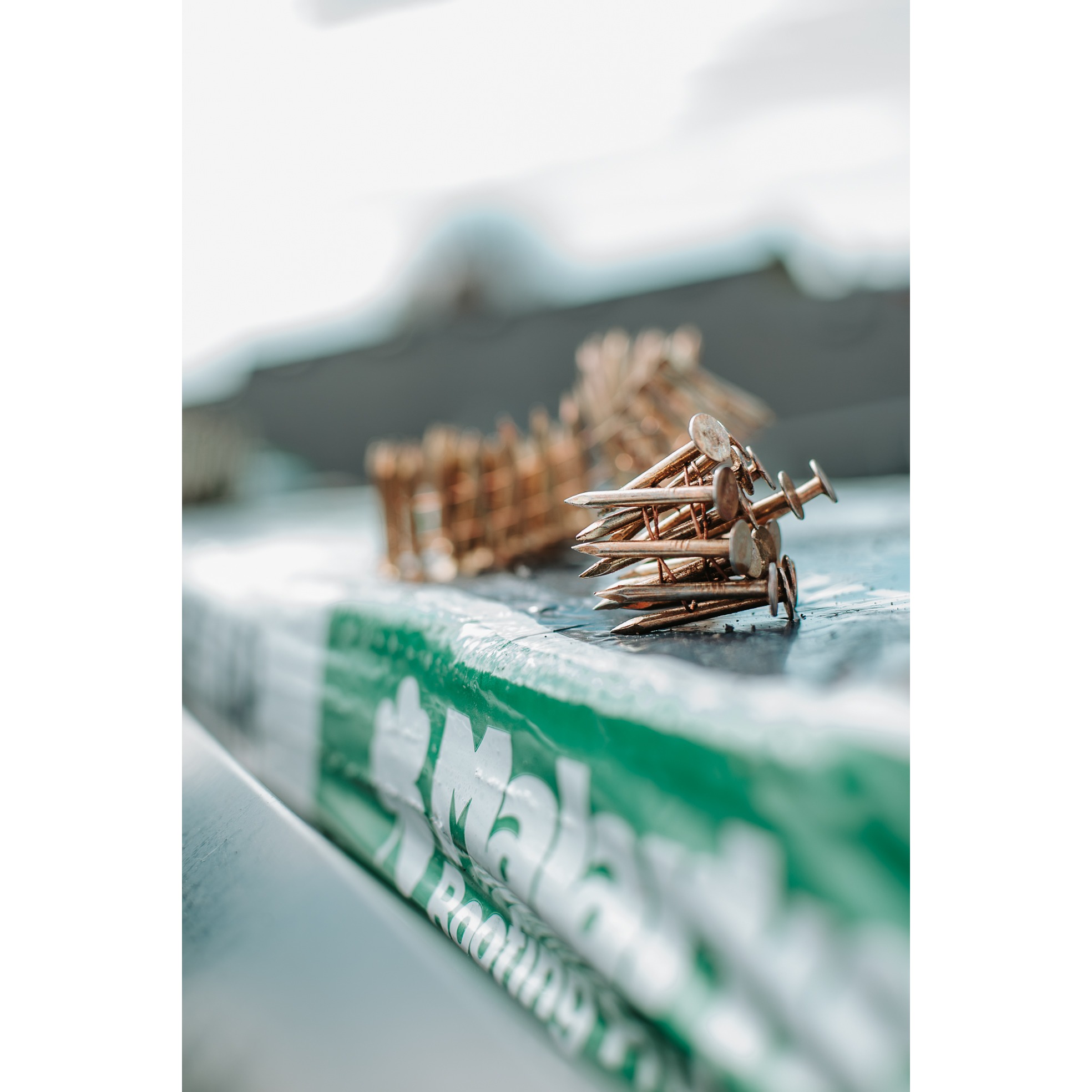 Roofing fasteners and installation materials prepared for a residential roofing project. 