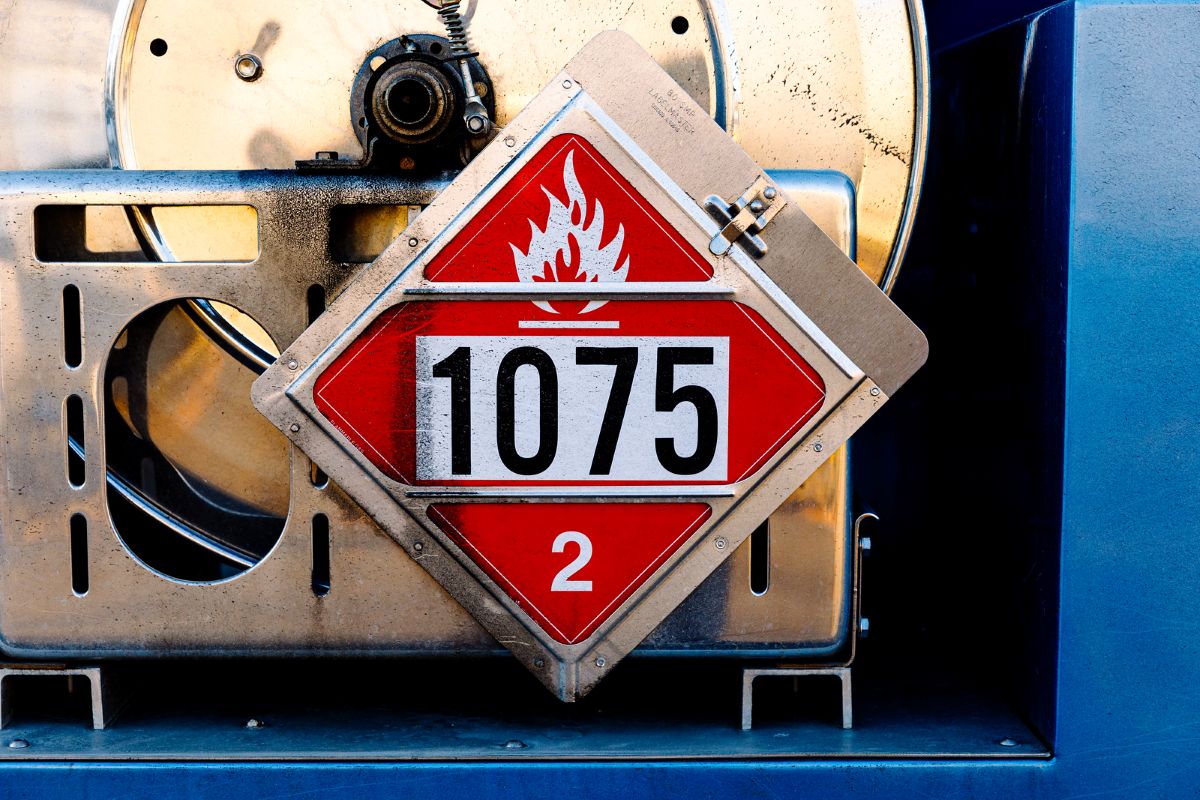 Close-up of safety equipment and hazardous material placards on a Beaupre Fuels delivery truck in Southern Maine. Beaupre Fuels prioritizes safe propane and heating oil delivery practices for residential and commercial customers throughout the region.