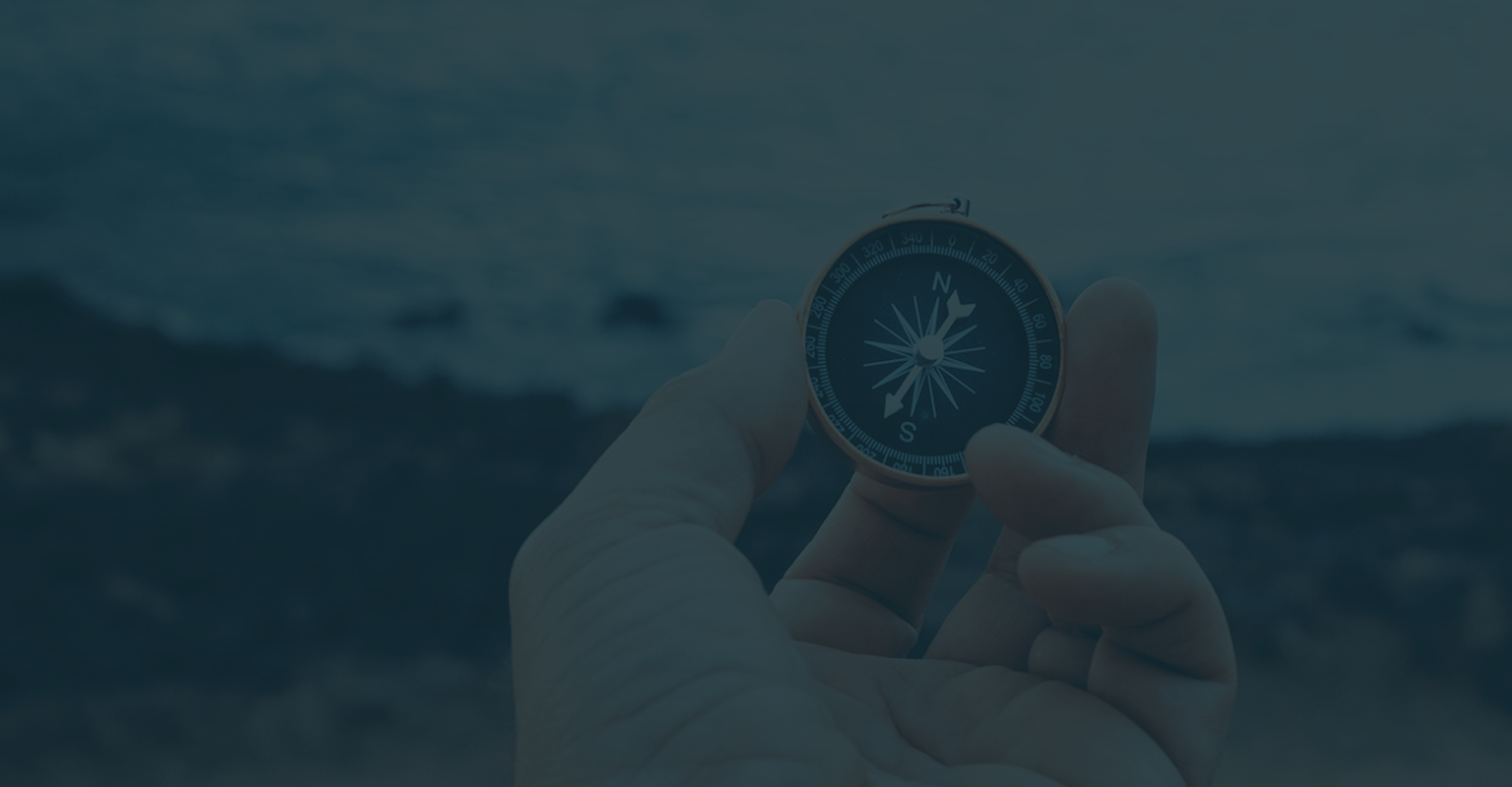 Close-up of an individual holding a compass.