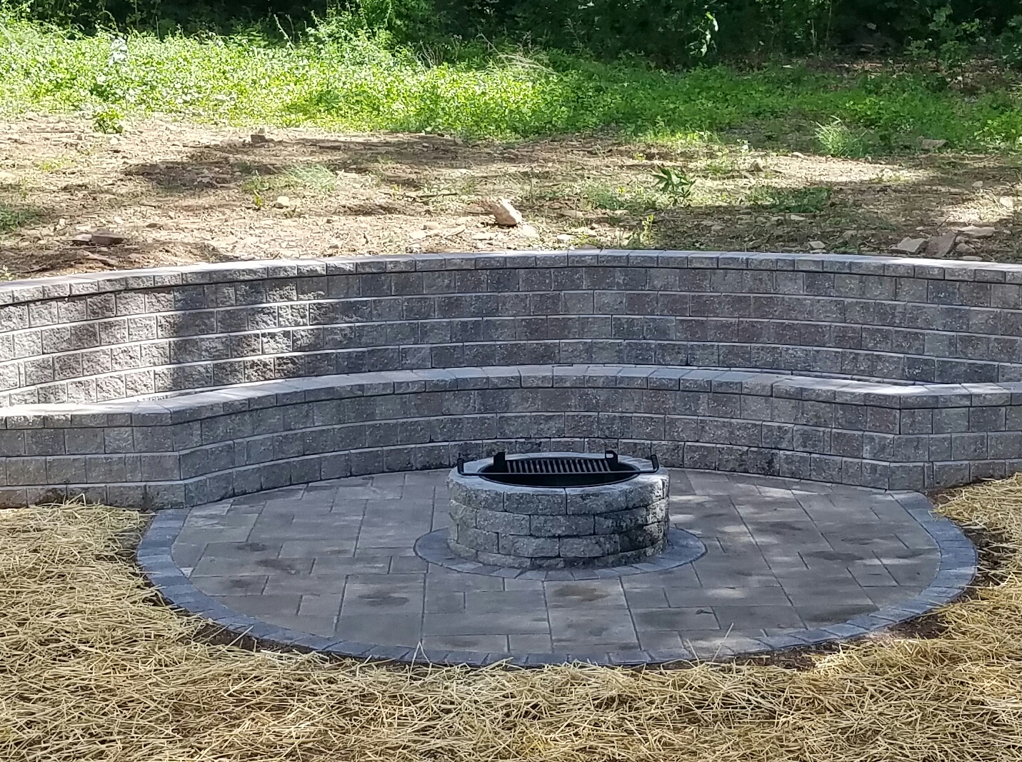 Unilock Concord wall with stairs, planter and firepit