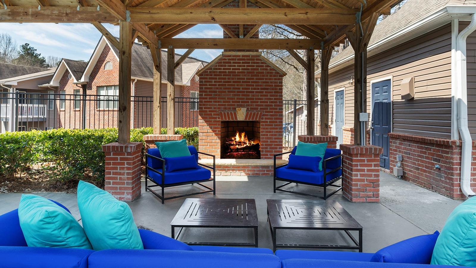 Outdoor cabana seating with fireplace.