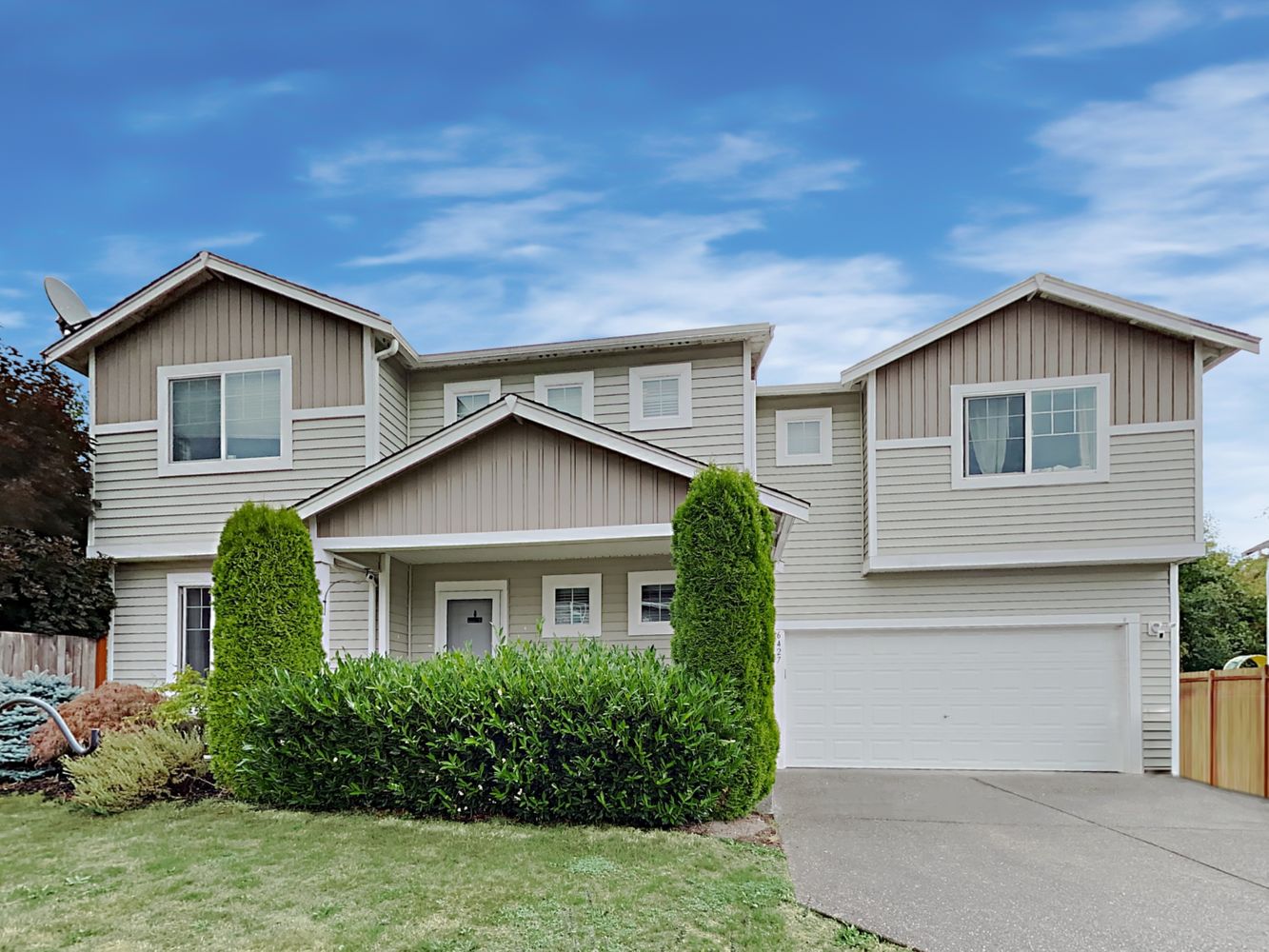 Charming home with two-car garage and fenced yard at Invitation Homes Seattle.